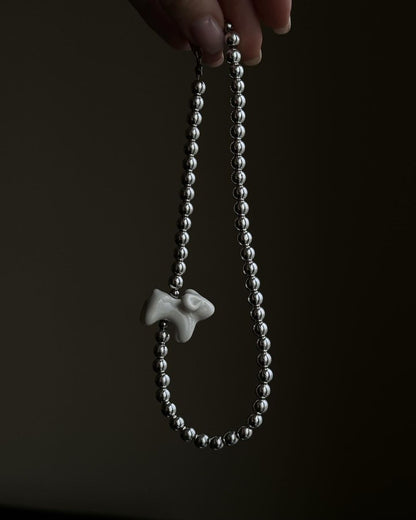 Hematite Beads with a Ceramic Lamb