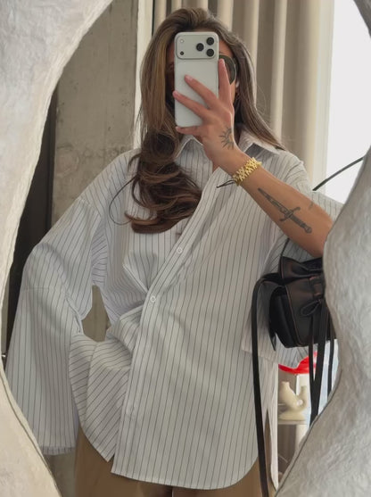 Loose-fit shirt with elongated cuffs